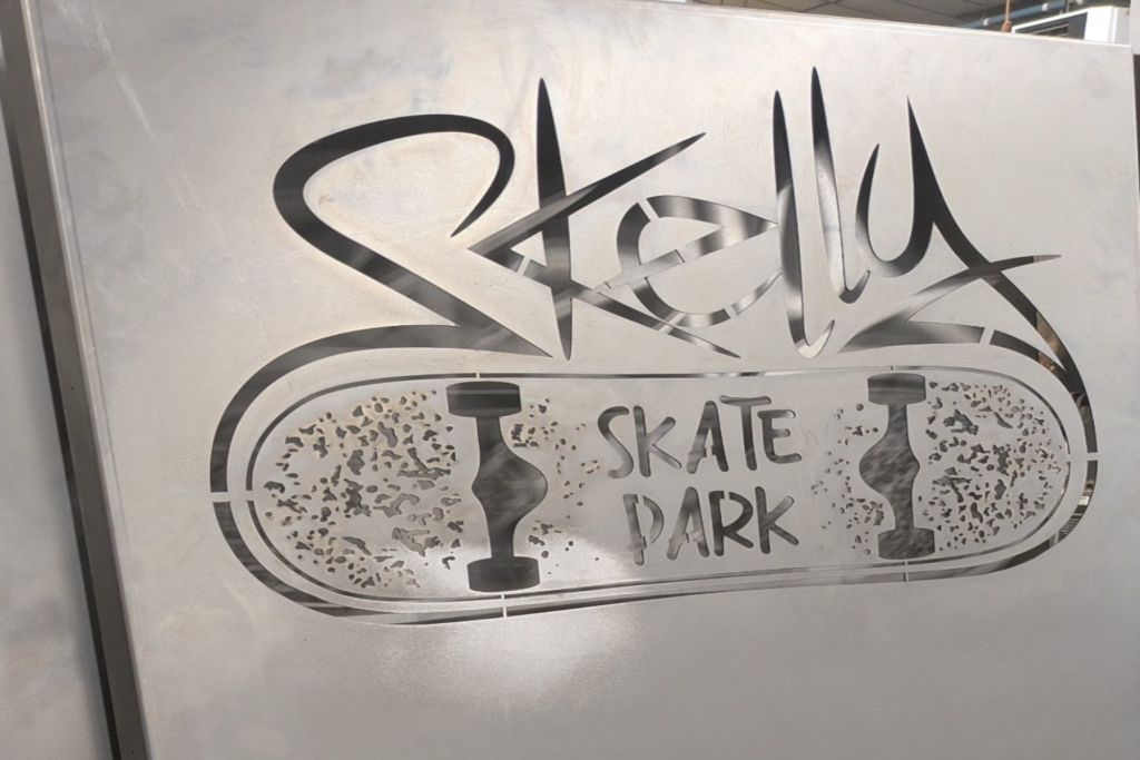Laser cut signs a metal skate park sign in workshop before welding
