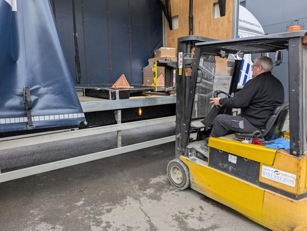 After our Laser Cutting Service a Forklift loading sheet metal pallet onto delivery lorry at MS Laser Services
