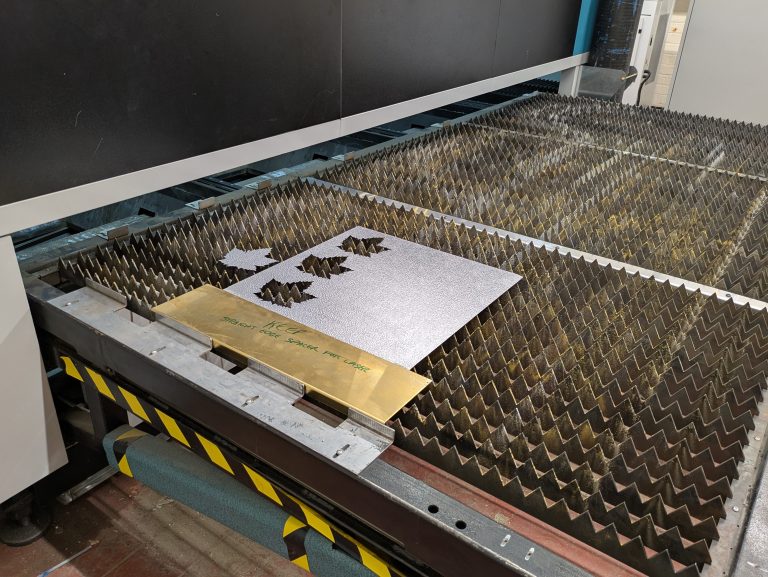 Aluminium stucco sheet being laser cut from a remnant for a prototype part