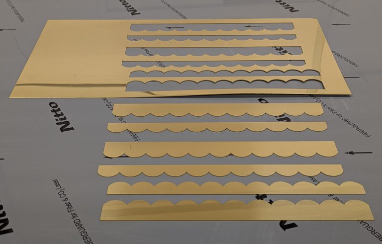 Laser cutting with remnants example a small laser cut job using a small polished brass sheet