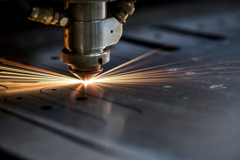 Laser cutting sheet metal with fibre laser machine – illustrative stock image