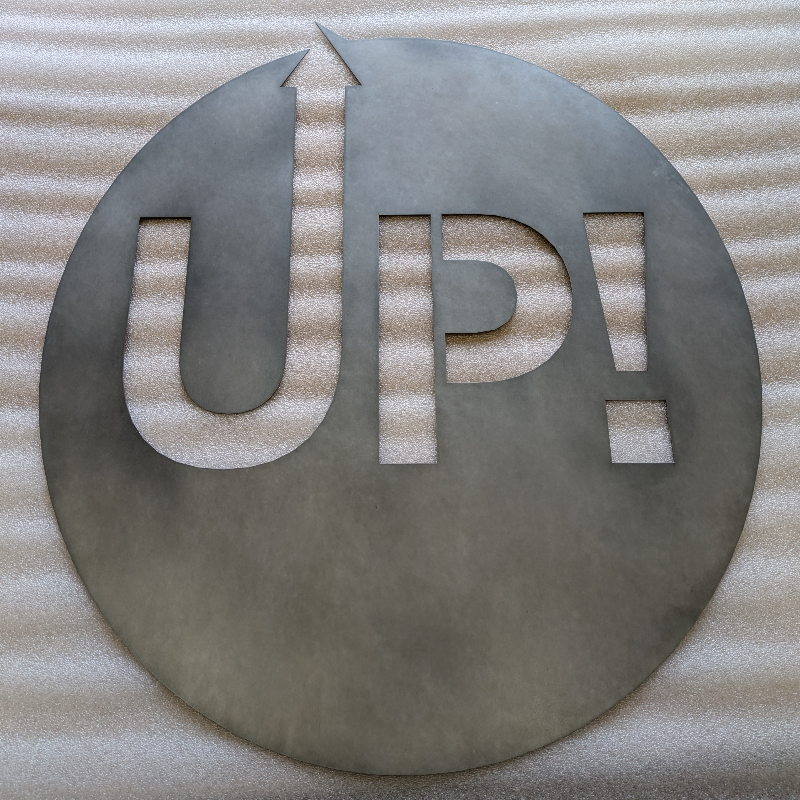 Laser-cut zinc logo sign showing detailed branding work